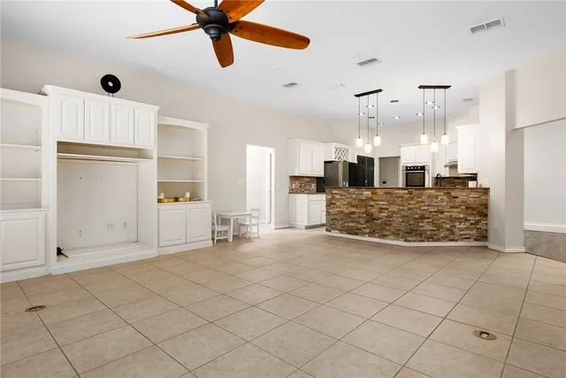 a view of a kitchen with furniture and a kitchen view