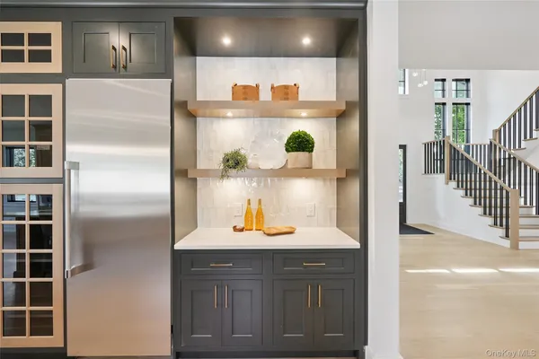 a kitchen with a refrigerator and cabinets