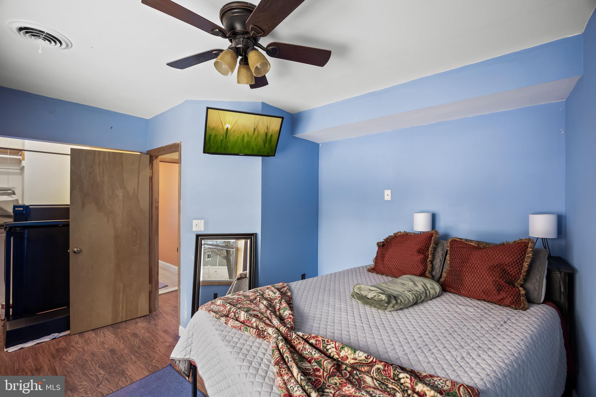 28 Oregon Avenue Mount Laurel, NJ 08054 - Photo 12 of 21 a bedroom with a bed and a chandelier