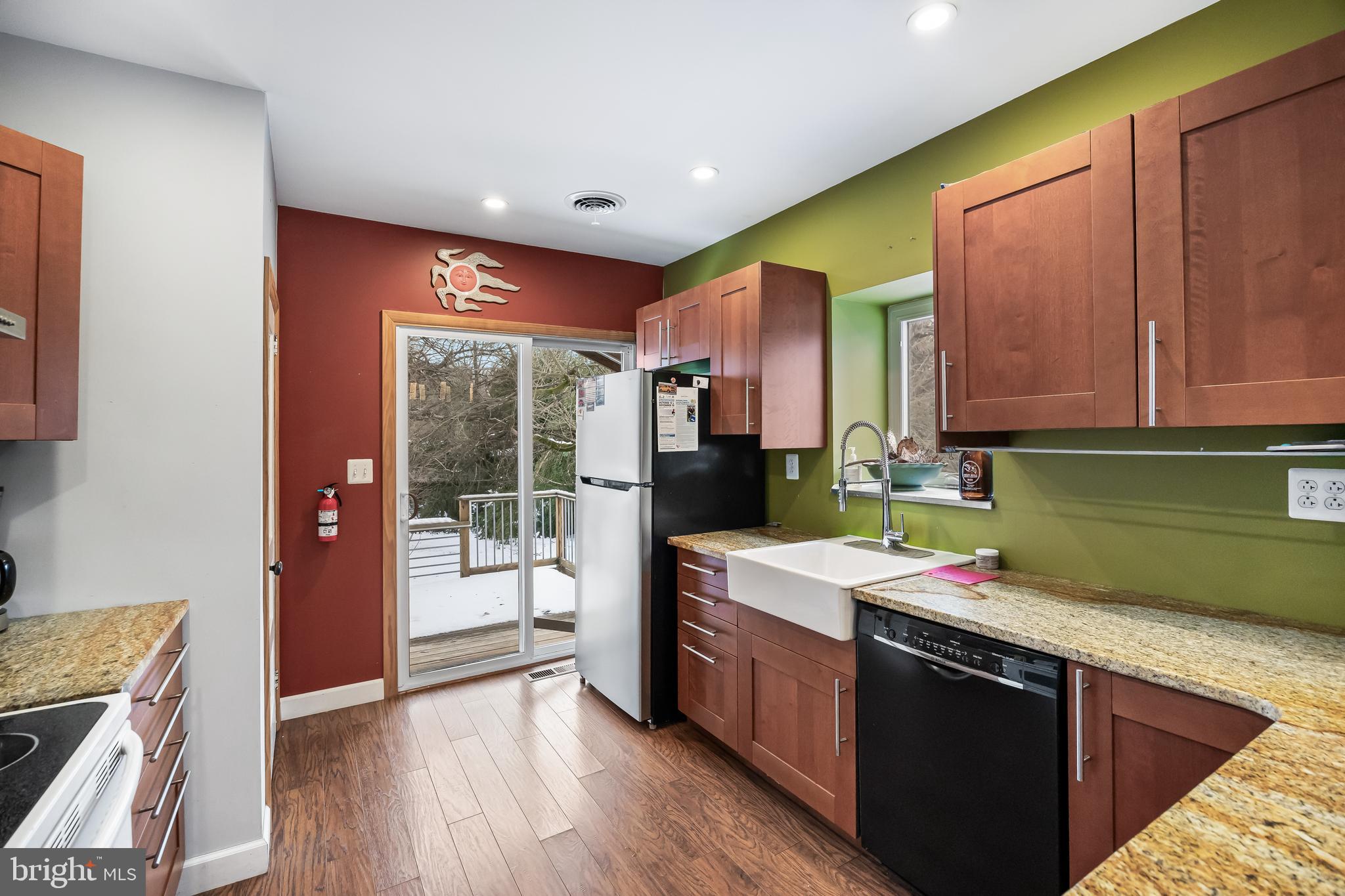 28 Oregon Avenue Mount Laurel, NJ 08054 - Photo 7 of 21 a kitchen with a sink a stove top oven cabinets and a wooden floor