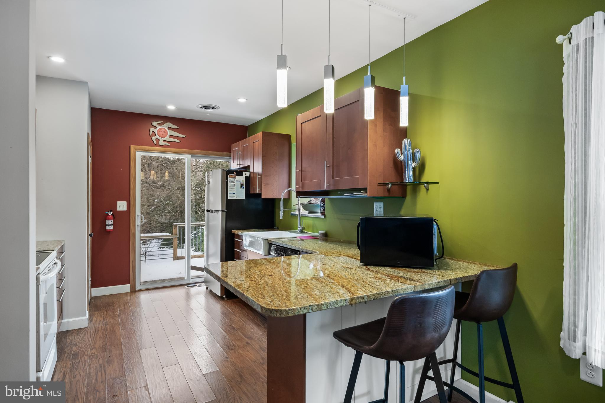 28 Oregon Avenue Mount Laurel, NJ 08054 - Photo 10 of 21 a kitchen with a table chairs refrigerator and cabinets
