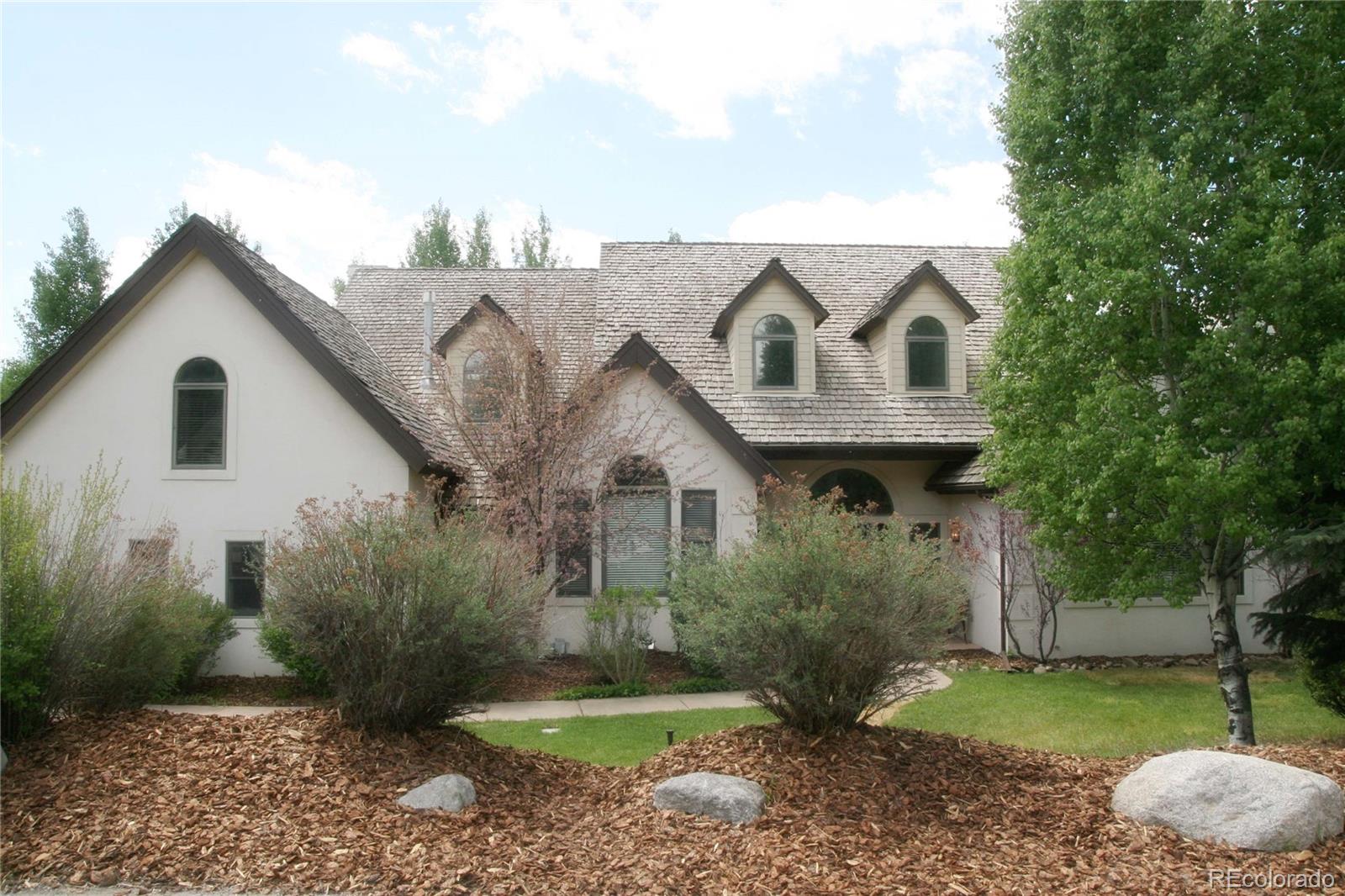 10 Shotgun Circle Edwards, CO 81632 - Photo 1 of 33 a front view of a house with garden