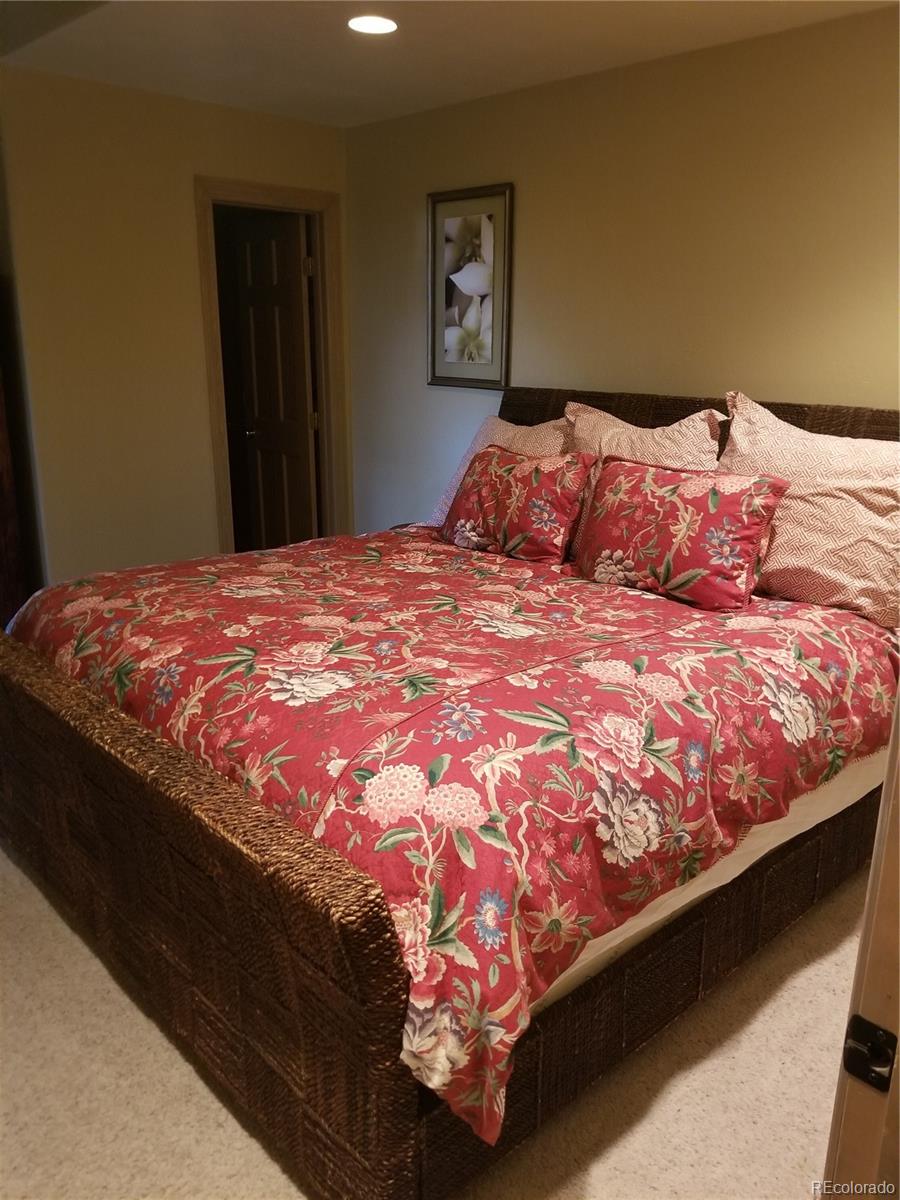 10 Shotgun Circle Edwards, CO 81632 - Photo 32 of 33 a bed sitting in a bedroom next to a window