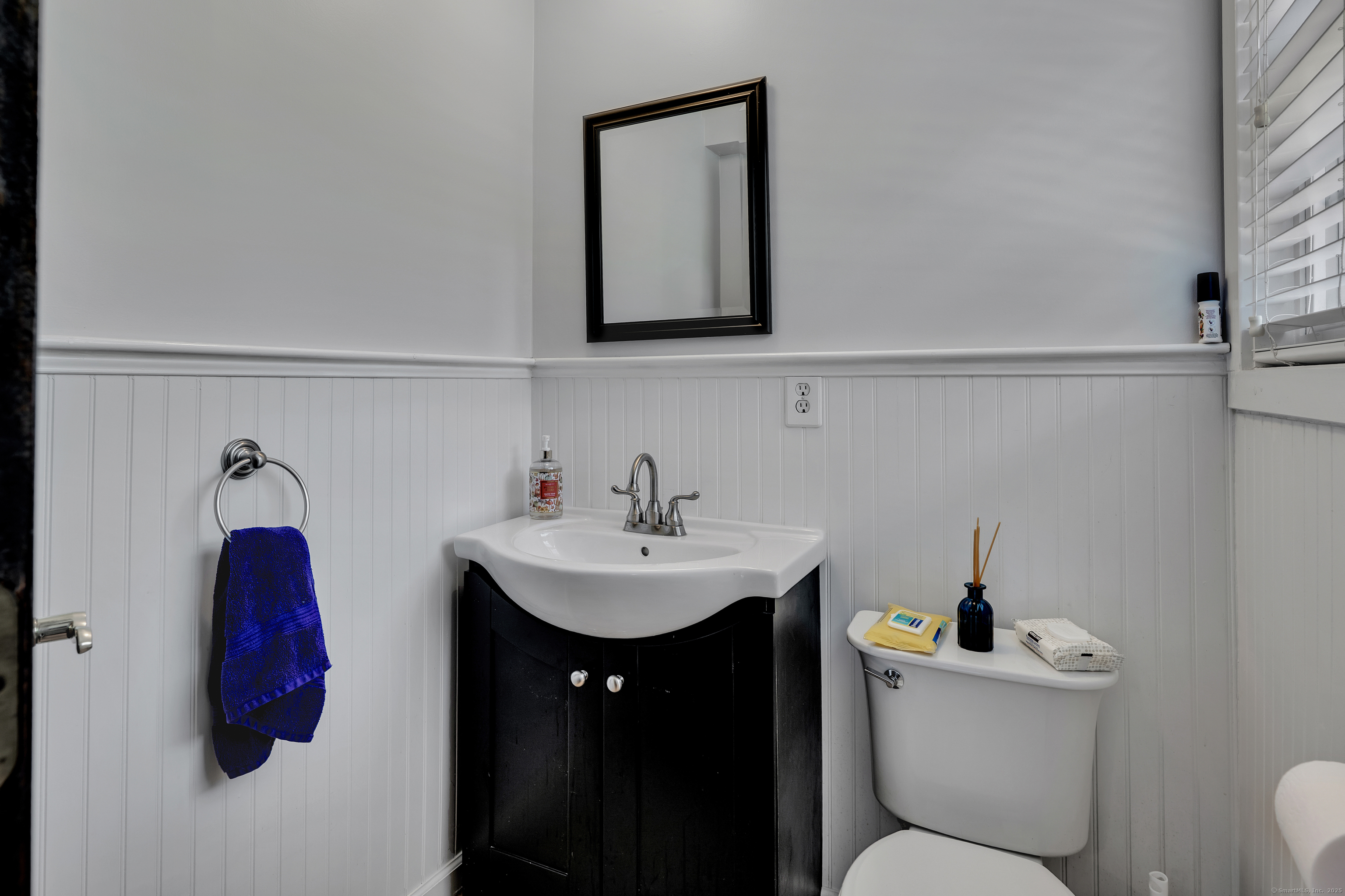21 Long Meadow Road Bethlehem, CT 06751 - Photo 18 of 32 a bathroom with a toilet sink and mirror