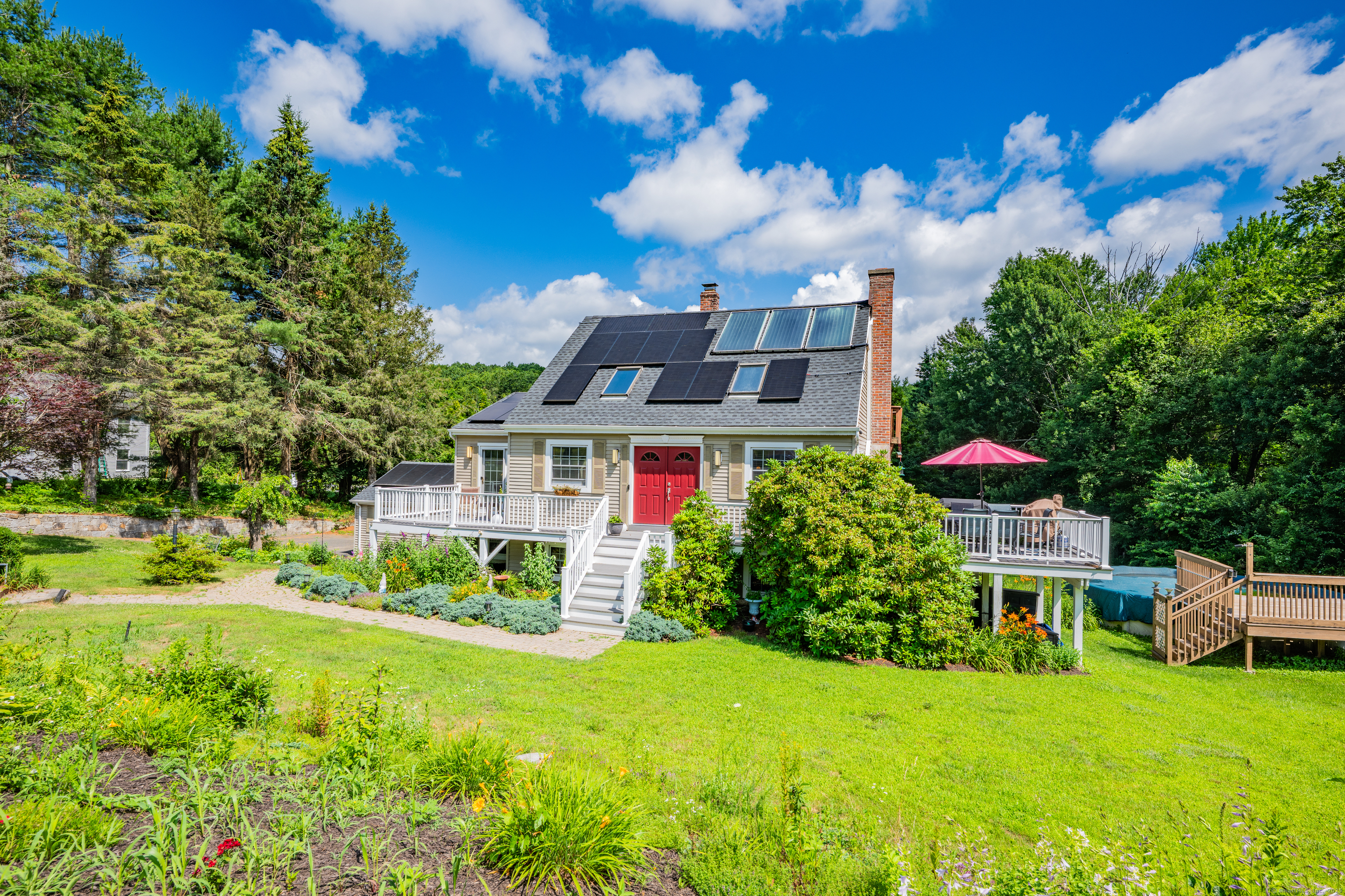 21 Long Meadow Road Bethlehem, CT 06751 - Photo 2 of 32 a view of a house with a big yard and potted plants