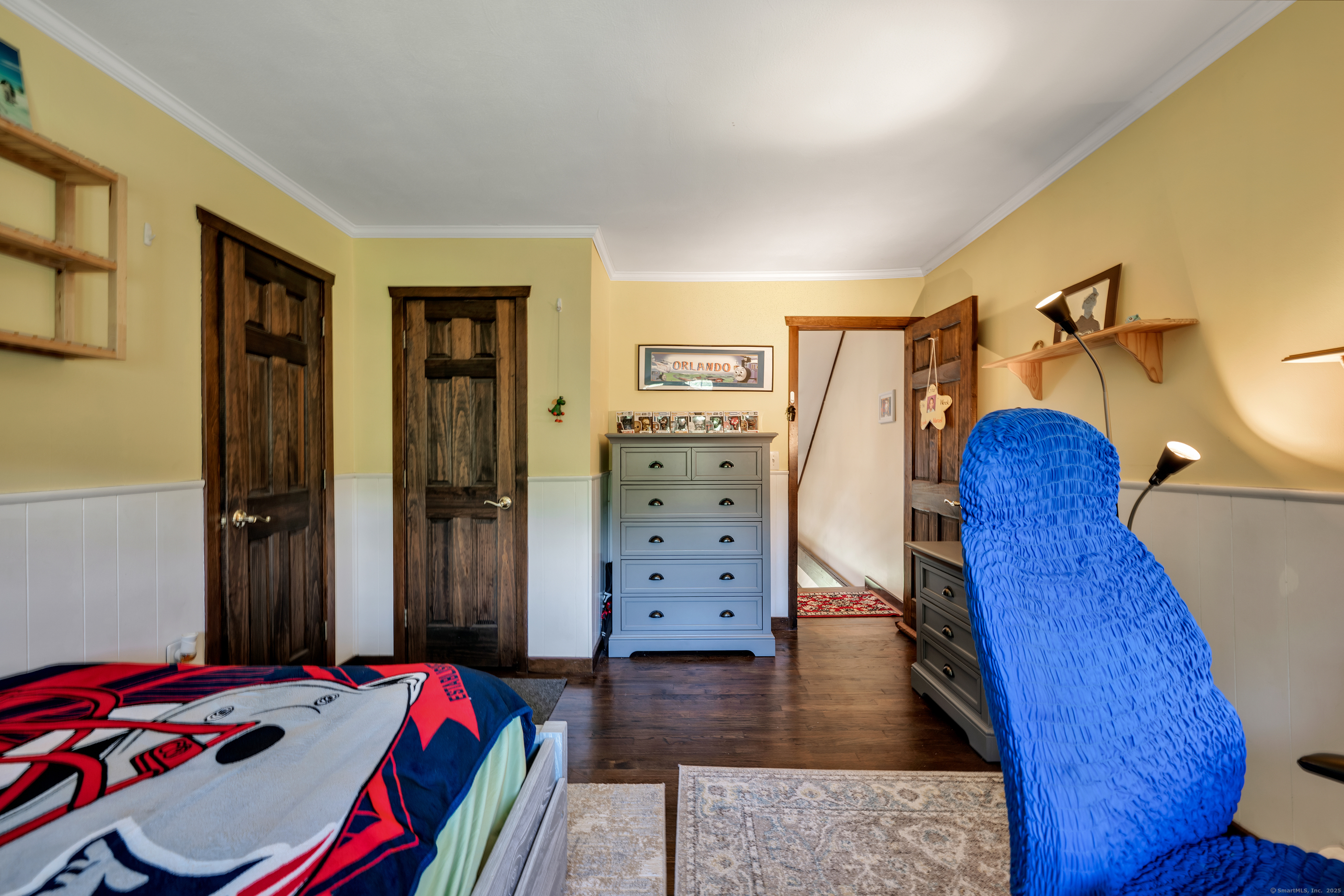 21 Long Meadow Road Bethlehem, CT 06751 - Photo 21 of 32 a bedroom with a bed and wooden floor