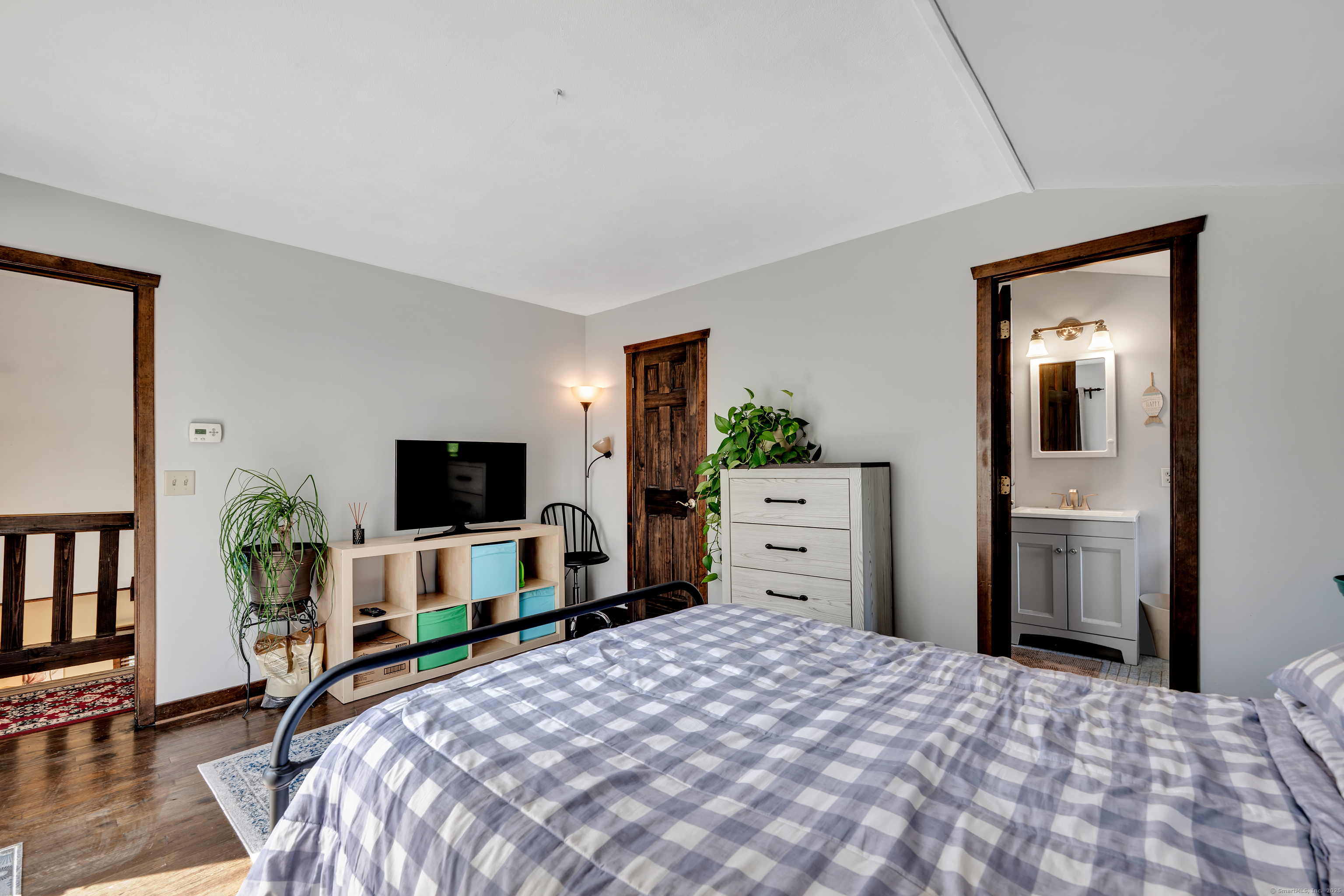 21 Long Meadow Road Bethlehem, CT 06751 - Photo 25 of 32 a bedroom with a bed and a flat screen tv