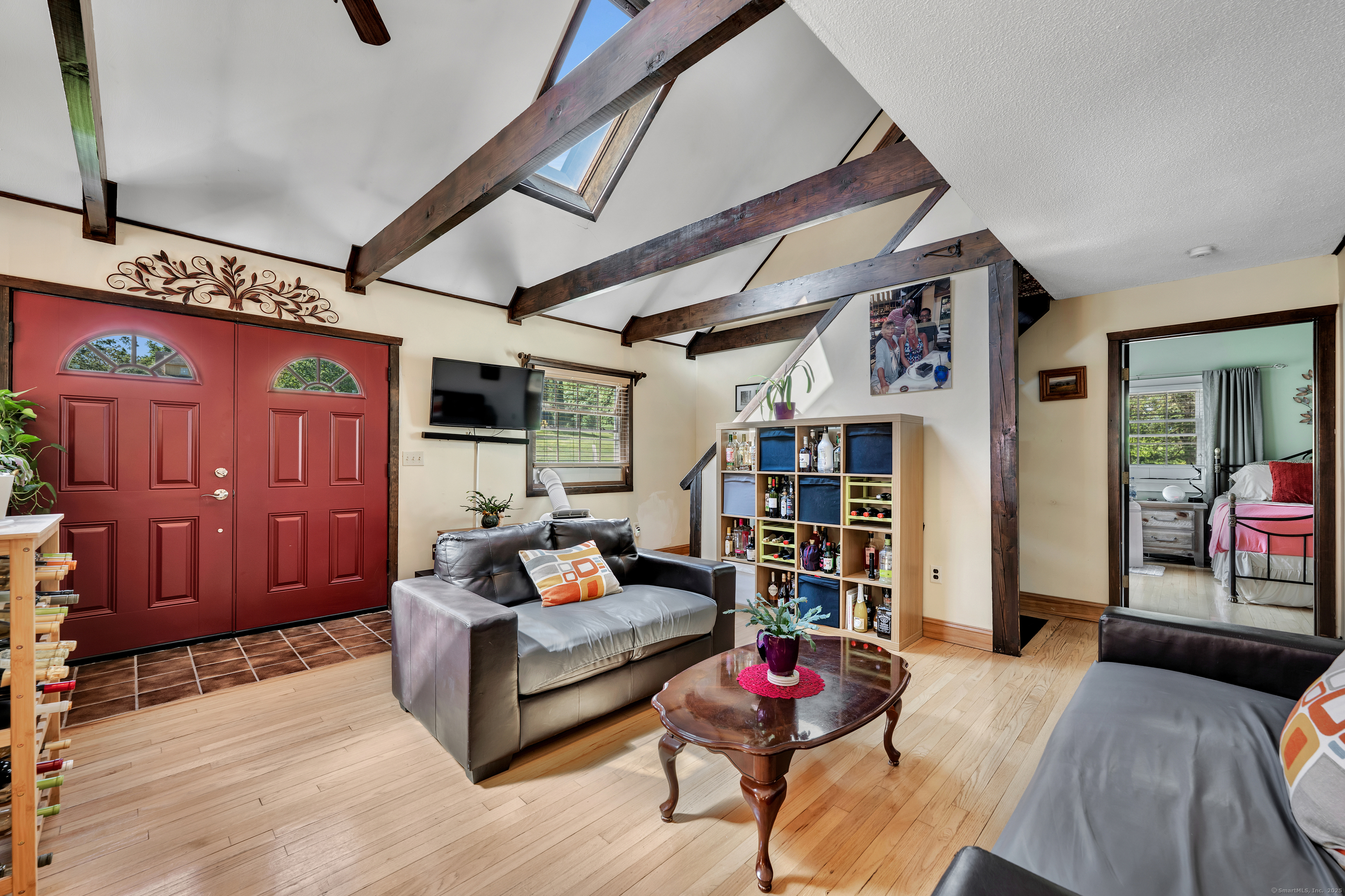 21 Long Meadow Road Bethlehem, CT 06751 - Photo 28 of 32 a living room with furniture a rug and a chandelier