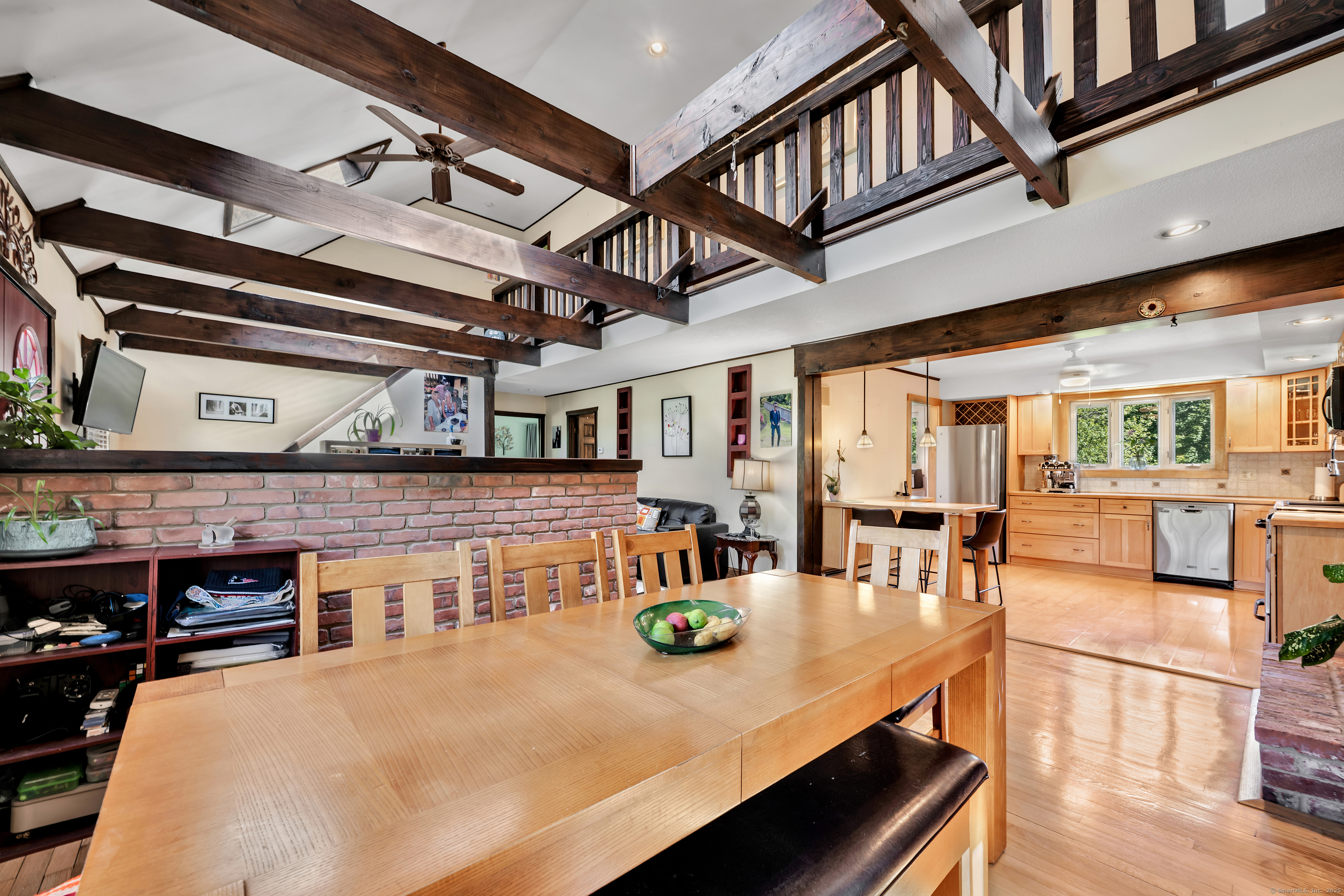 21 Long Meadow Road Bethlehem, CT 06751 - Photo 30 of 32 a view of a dining room with furniture a chandelier and wooden floor