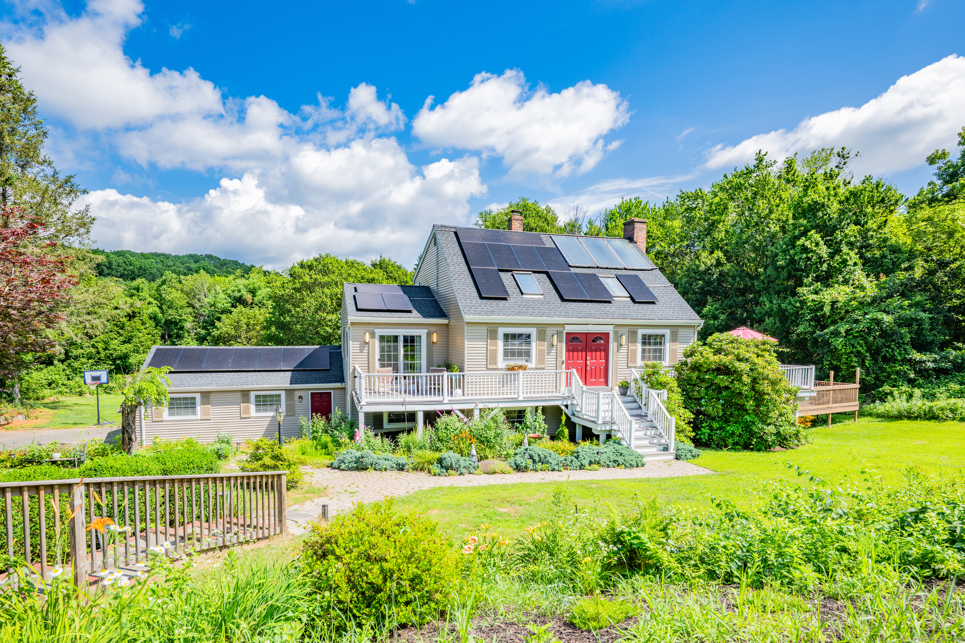 21 Long Meadow Road Bethlehem, CT 06751 - Photo 5 of 32 a front view of a house with a yard