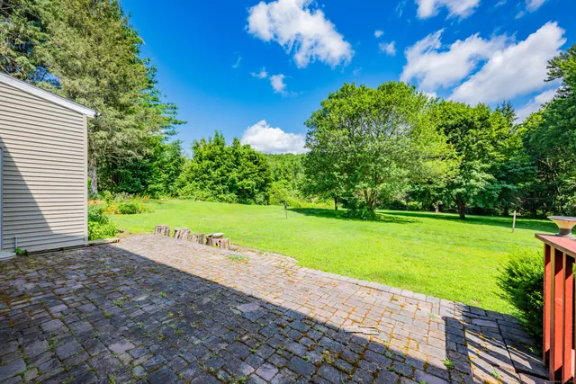 a view of a house with a big yard