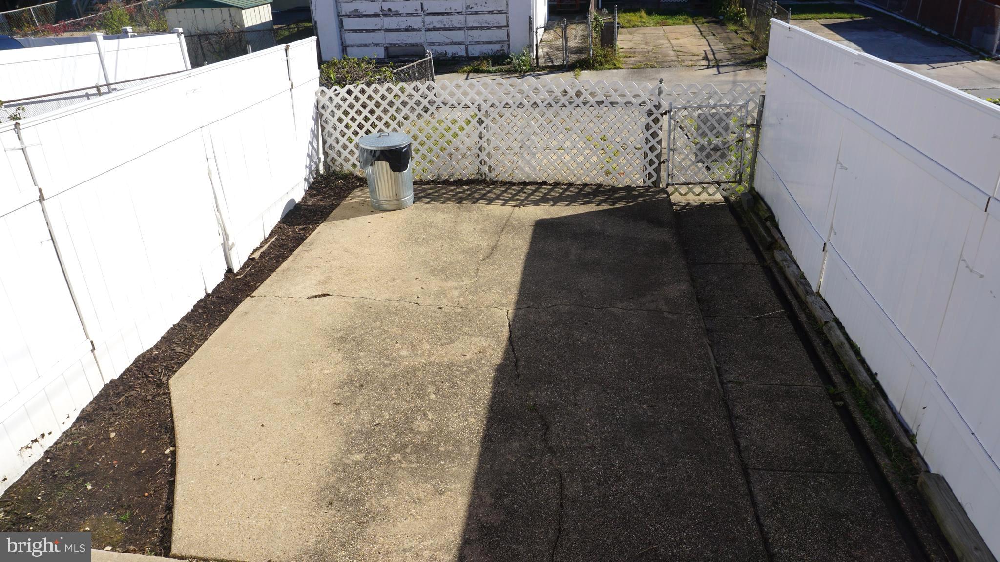 2230 Coralthorn Road Middle River, MD 21220 - Photo 21 of 30 Rear Yard and Parking Beyond Fence