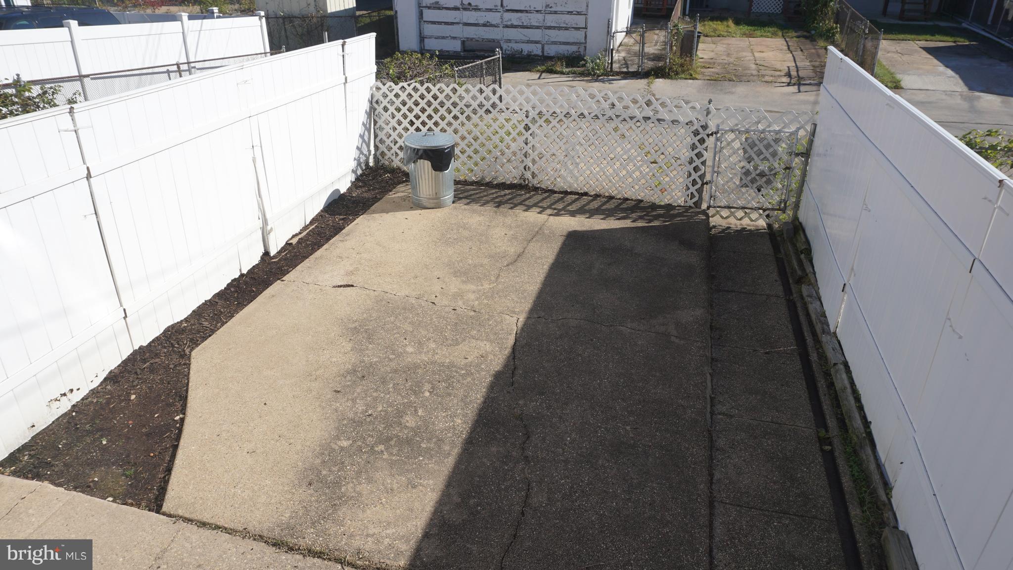 2230 Coralthorn Road Middle River, MD 21220 - Photo 6 of 30 Yard and Parking Pad. Remove fence to add parking.