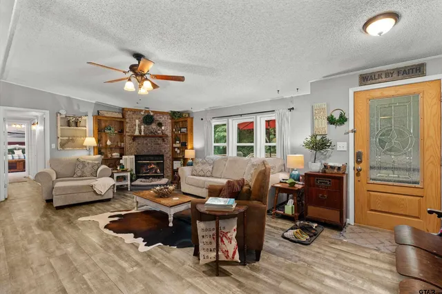 a living room with furniture and a fireplace