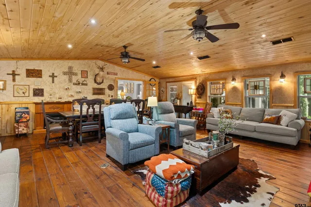 a work place with a large bed and lots of windows