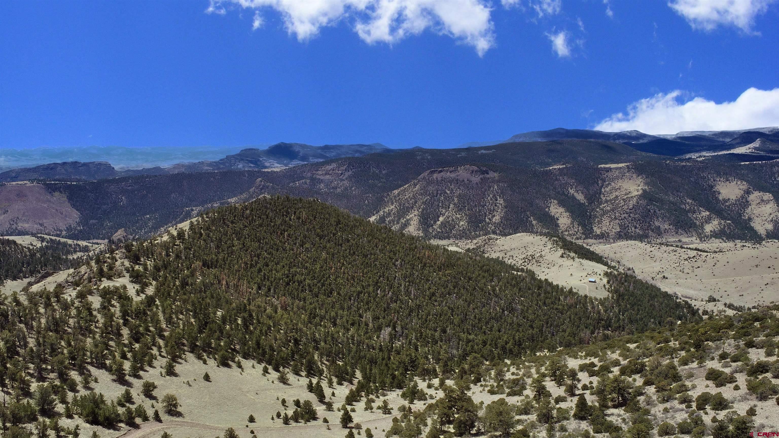 Tbd Tbd Tbd La Del Norte, CO 81132 - Photo 4 of 10 a view of a dry yard with mountains in the background