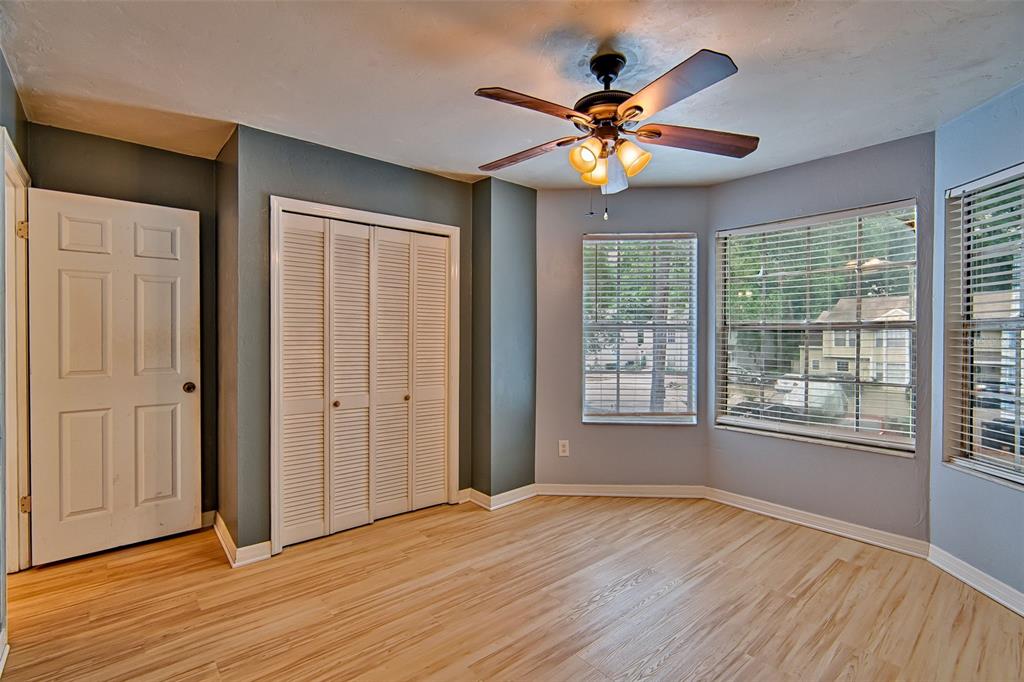 2305 Southwest 73rd Terrace Gainesville, FL 32607 - Photo 12 of 21 a view of an empty room with wooden floor and a window