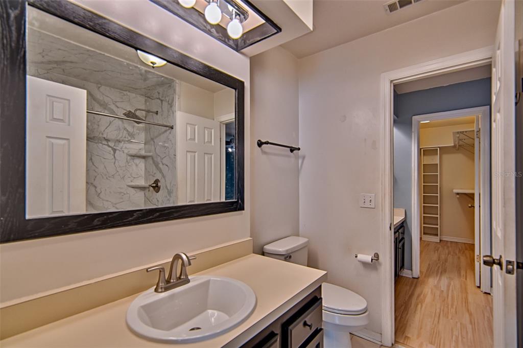 2305 Southwest 73rd Terrace Gainesville, FL 32607 - Photo 13 of 21 a bathroom with a sink a toilet and shower