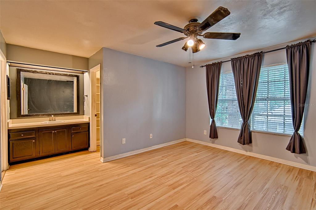 2305 Southwest 73rd Terrace Gainesville, FL 32607 - Photo 15 of 21 a view of an empty room with a window and wooden floor