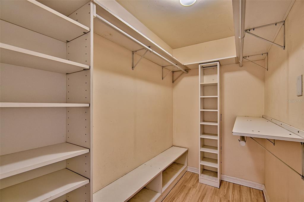 2305 Southwest 73rd Terrace Gainesville, FL 32607 - Photo 17 of 21 a view of walk in closet with empty racks