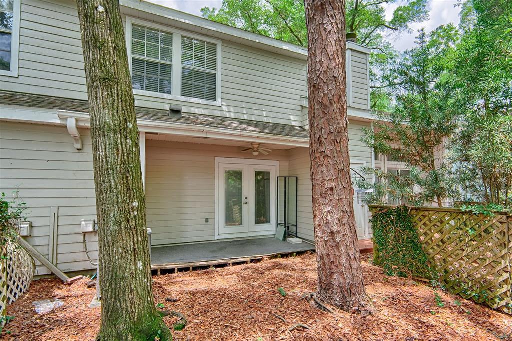 2305 Southwest 73rd Terrace Gainesville, FL 32607 - Photo 19 of 21 a front view of a house with a tree