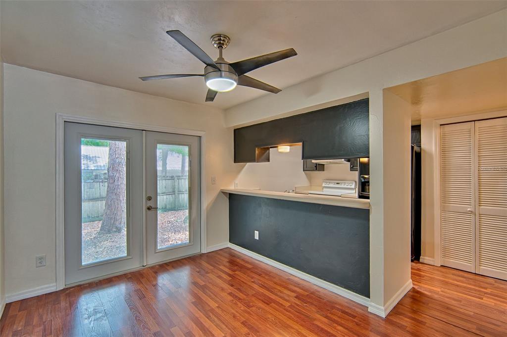 2305 Southwest 73rd Terrace Gainesville, FL 32607 - Photo 4 of 21 a view of livingroom with hardwood floor and a ceiling fan