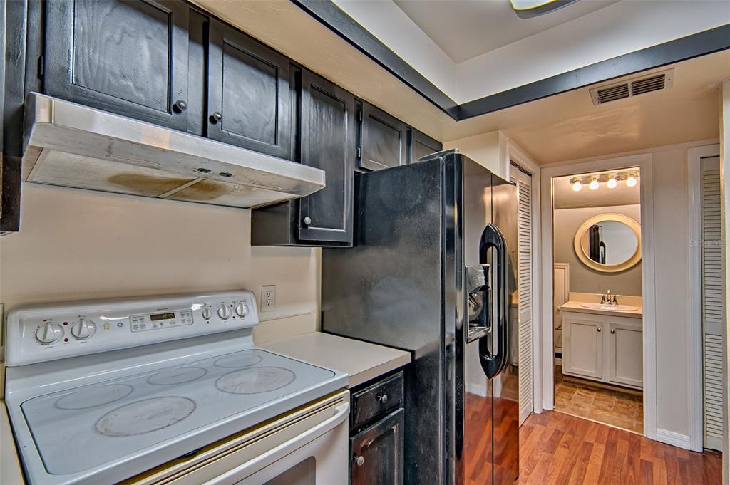 2305 Southwest 73rd Terrace Gainesville, FL 32607 - Photo 8 of 21 a kitchen with a stove and a refrigerator