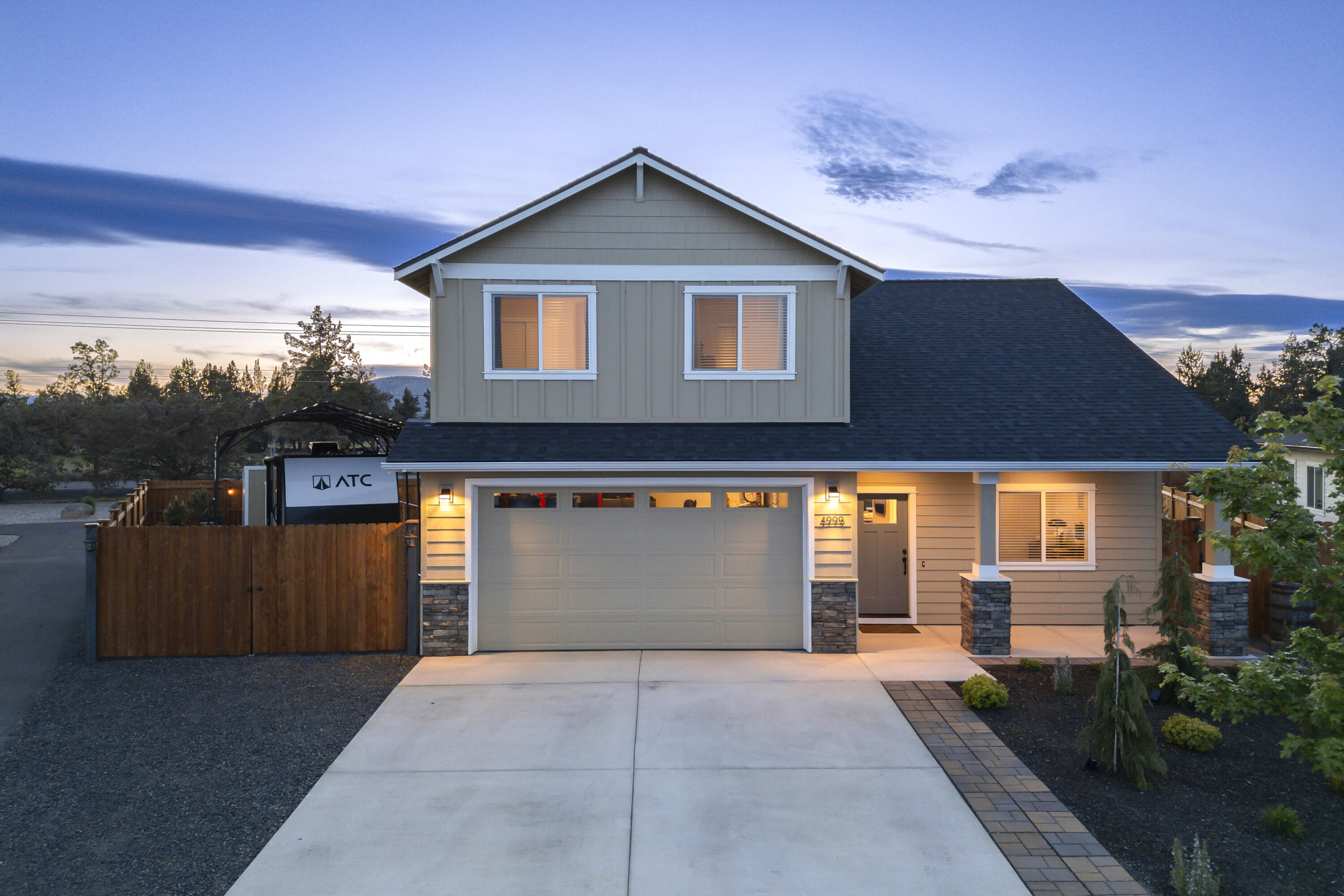 4999 Southwest Yew Place Redmond, OR 97756 - Photo 48 of 50 a front view of a house with a yard and garage