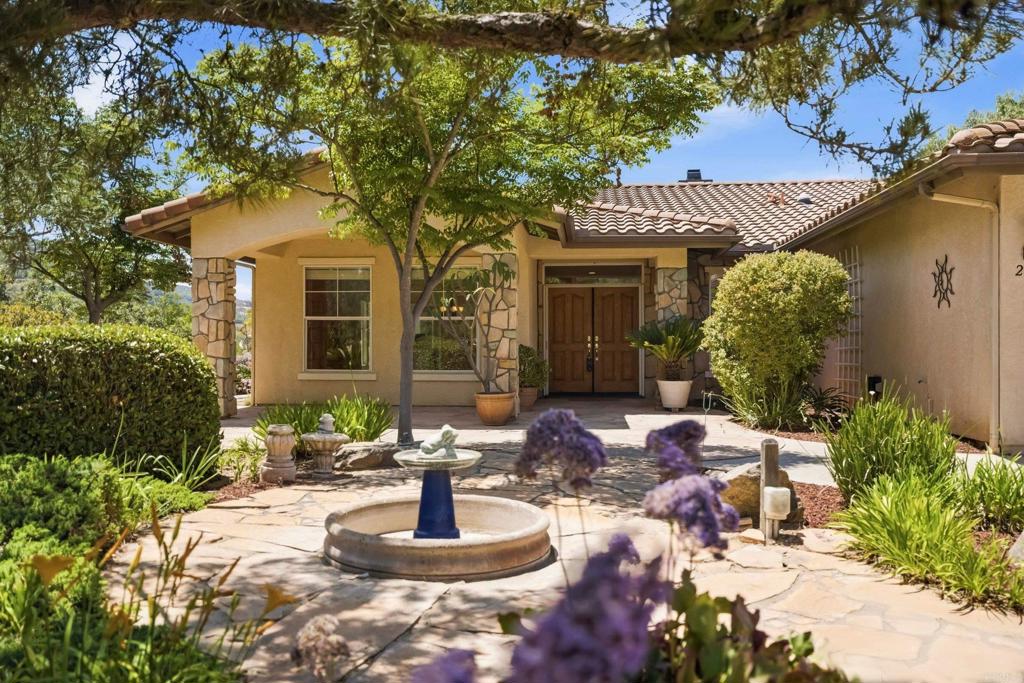 2527 Southern Oak Road Ramona, CA 92065 - Photo 9 of 56 a front view of a house with garden