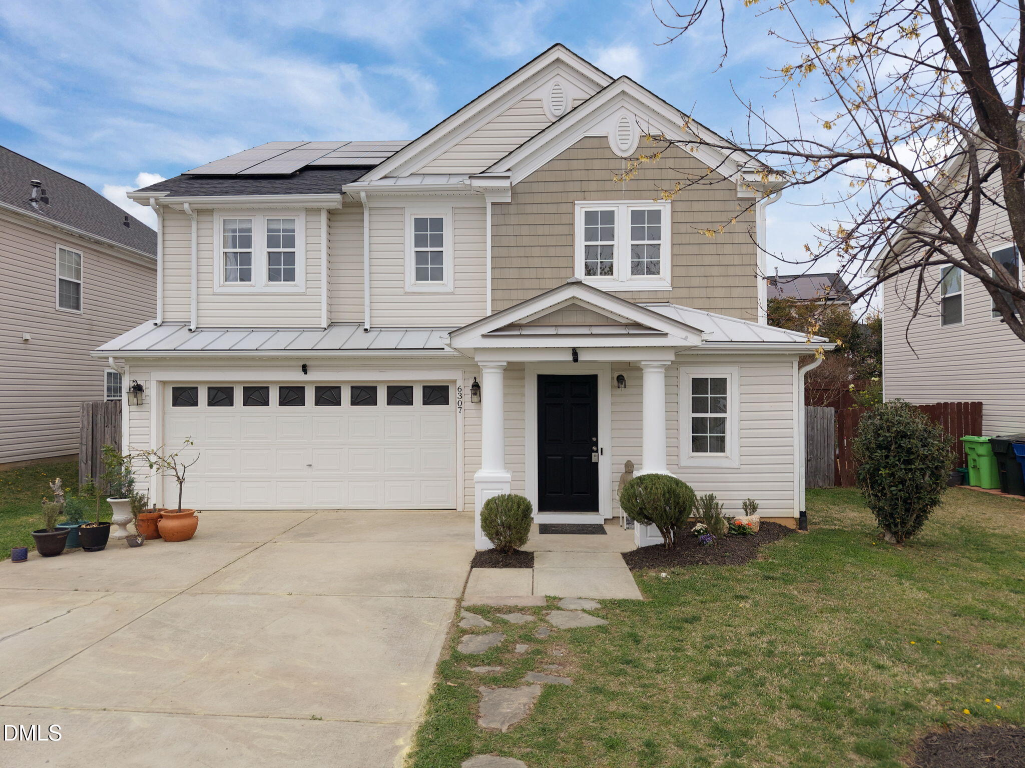 6307 Quitman Trail Raleigh, NC 27610 - Photo 1 of 35 a view of a white house with a yard and plants