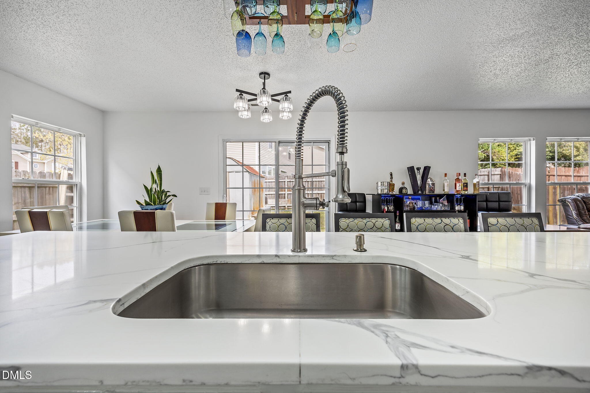 6307 Quitman Trail Raleigh, NC 27610 - Photo 17 of 35 a kitchen with a sink and a large window