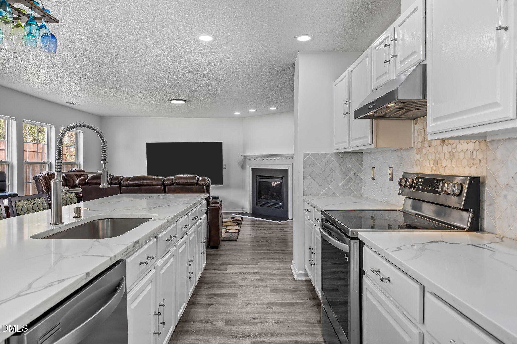 6307 Quitman Trail Raleigh, NC 27610 - Photo 18 of 35 a kitchen with a sink stove and cabinets