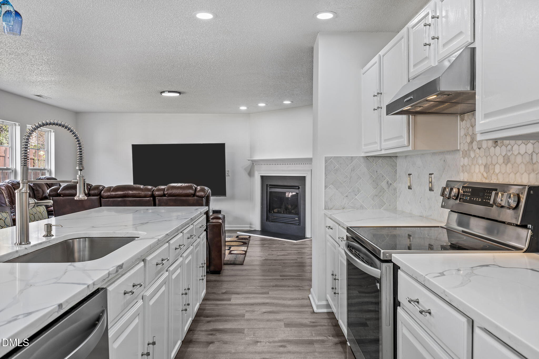 6307 Quitman Trail Raleigh, NC 27610 - Photo 19 of 35 a kitchen with a sink stove top oven and cabinets