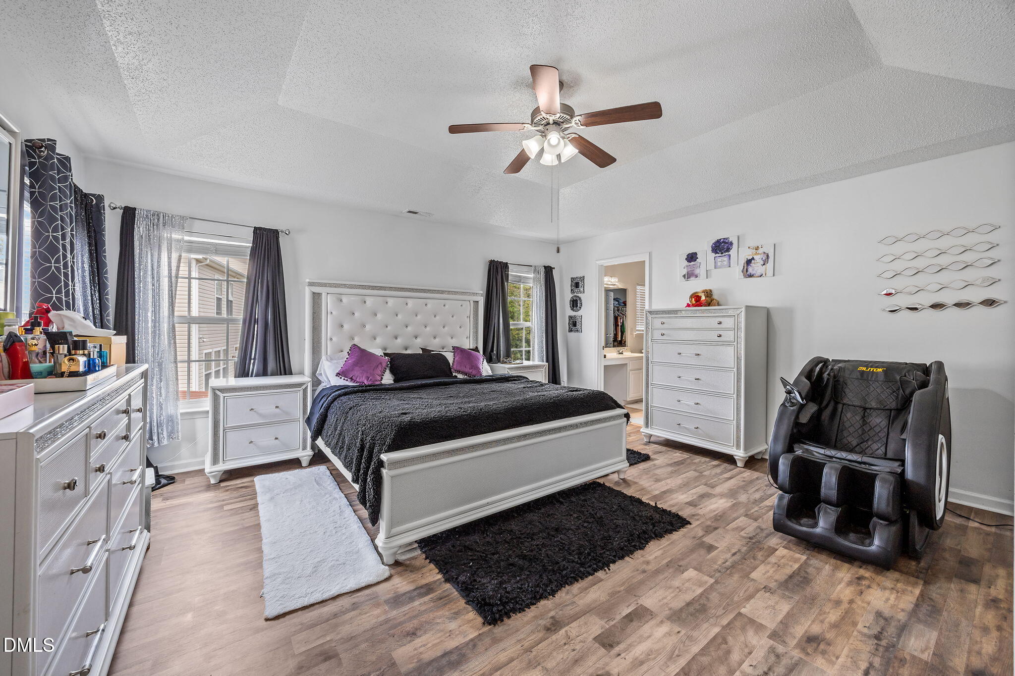 6307 Quitman Trail Raleigh, NC 27610 - Photo 23 of 35 a bedroom with a bed a couch and dresser