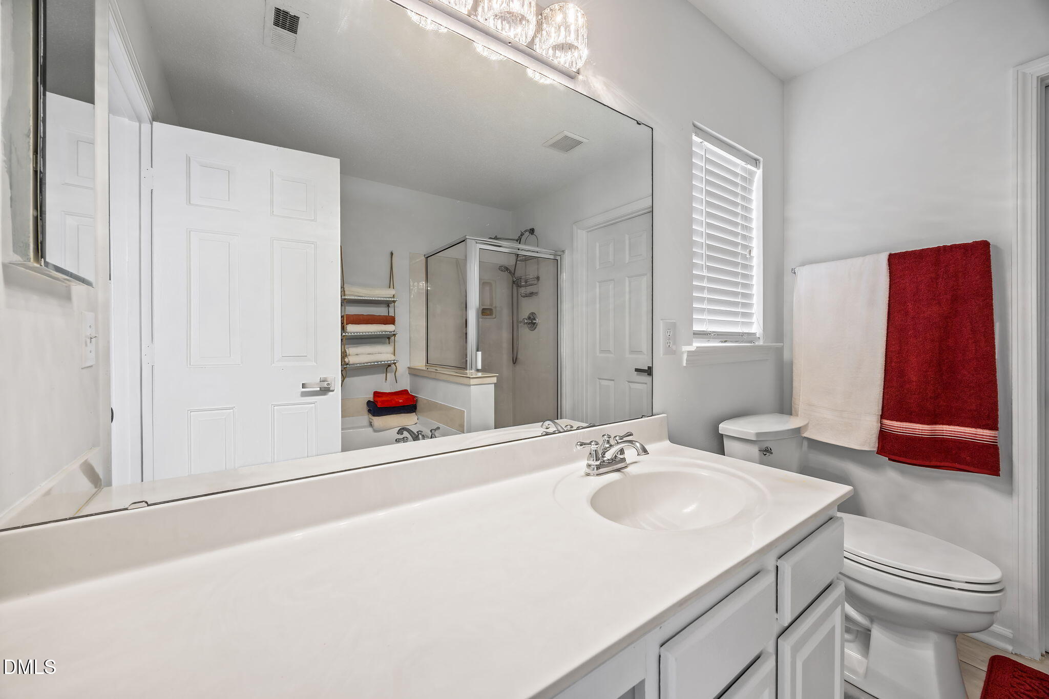 6307 Quitman Trail Raleigh, NC 27610 - Photo 24 of 35 a bathroom with a sink and a mirror