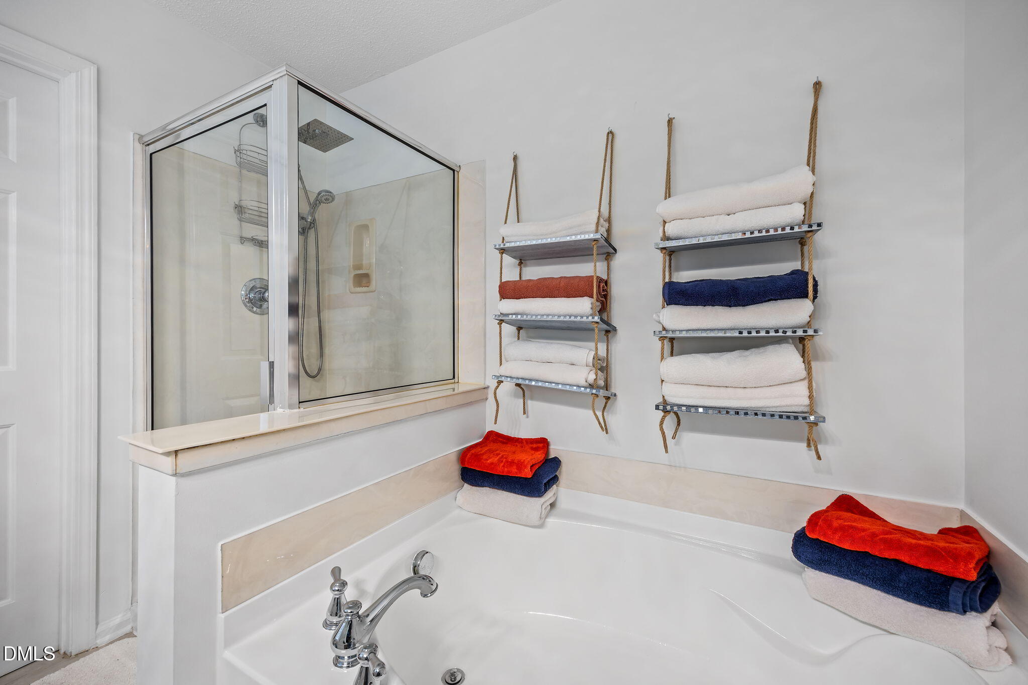 6307 Quitman Trail Raleigh, NC 27610 - Photo 25 of 35 a bathroom with a tub and shower