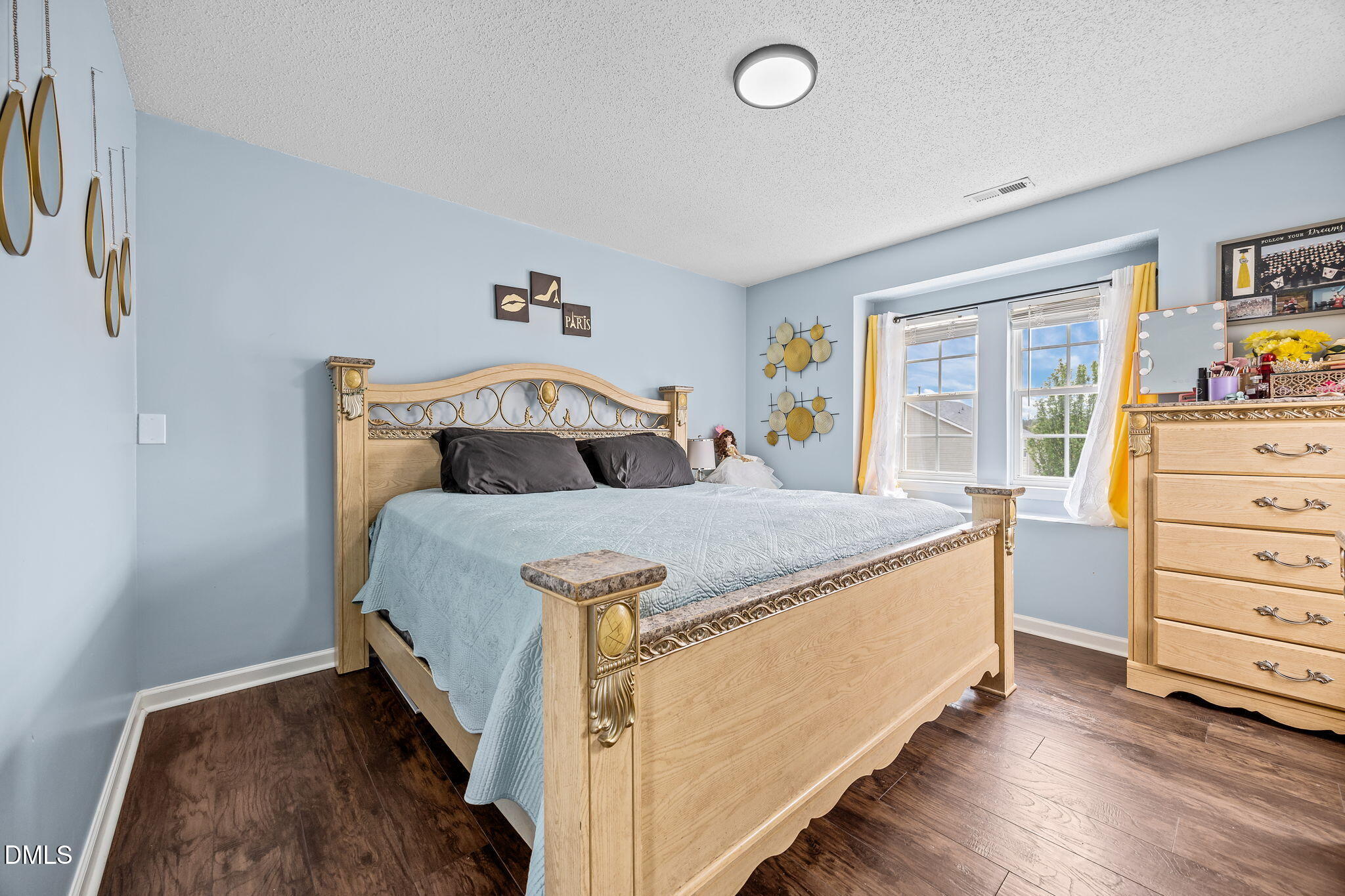 6307 Quitman Trail Raleigh, NC 27610 - Photo 27 of 35 a bedroom with a bed and a window