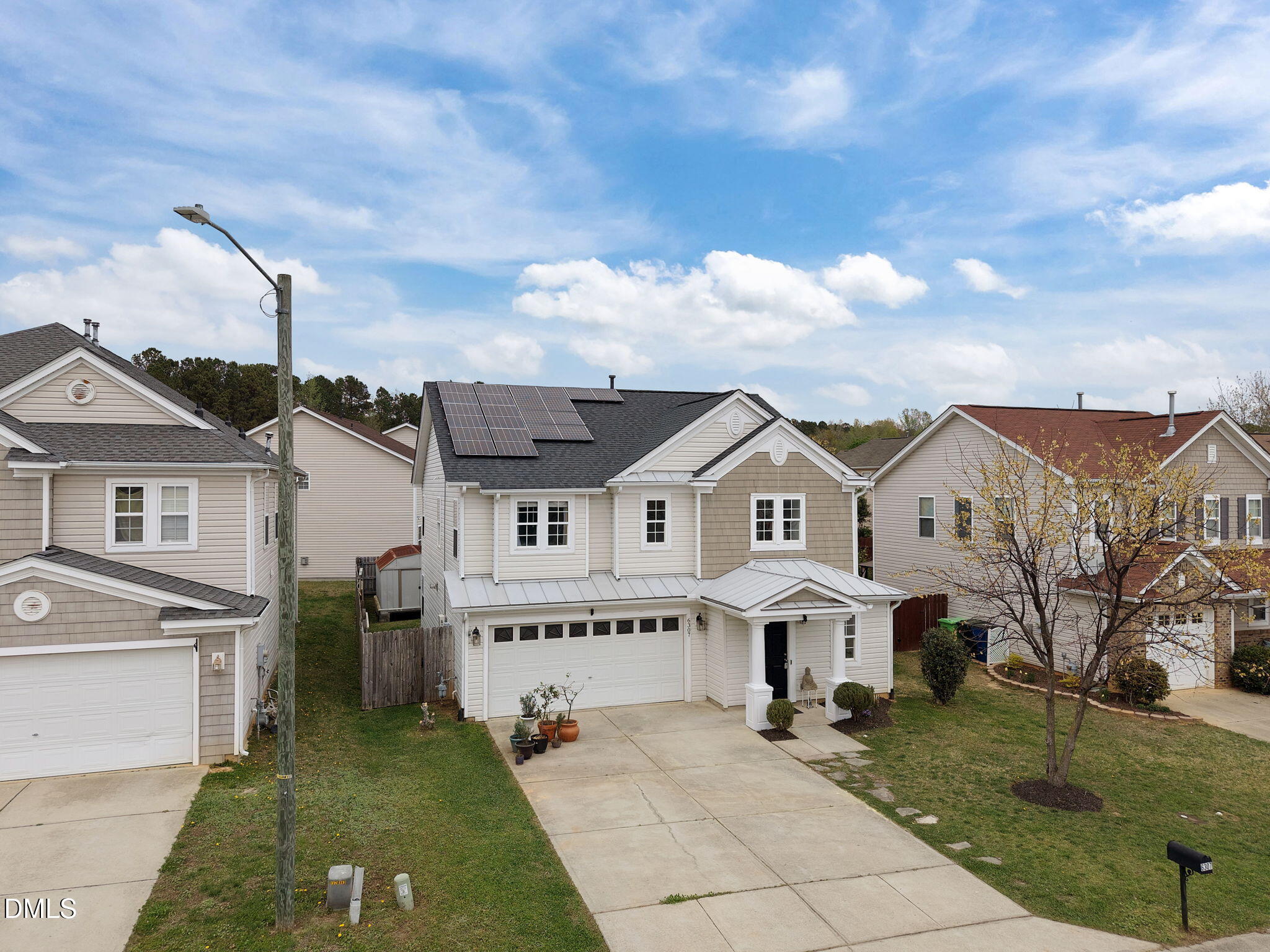 6307 Quitman Trail Raleigh, NC 27610 - Photo 3 of 35 a view of house with garden and tall tress
