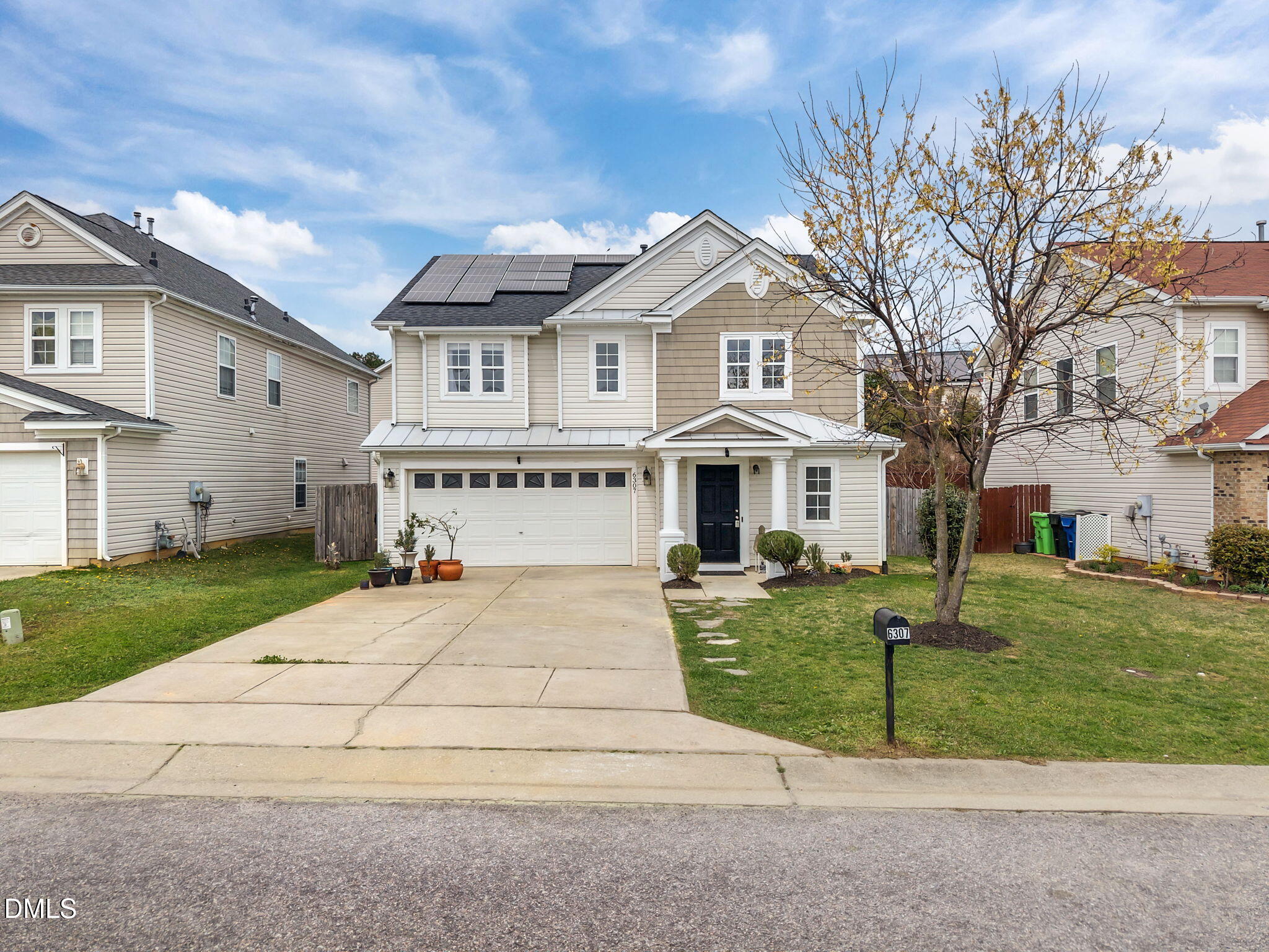6307 Quitman Trail Raleigh, NC 27610 - Photo 35 of 35 a view of a white house with a yard and plants