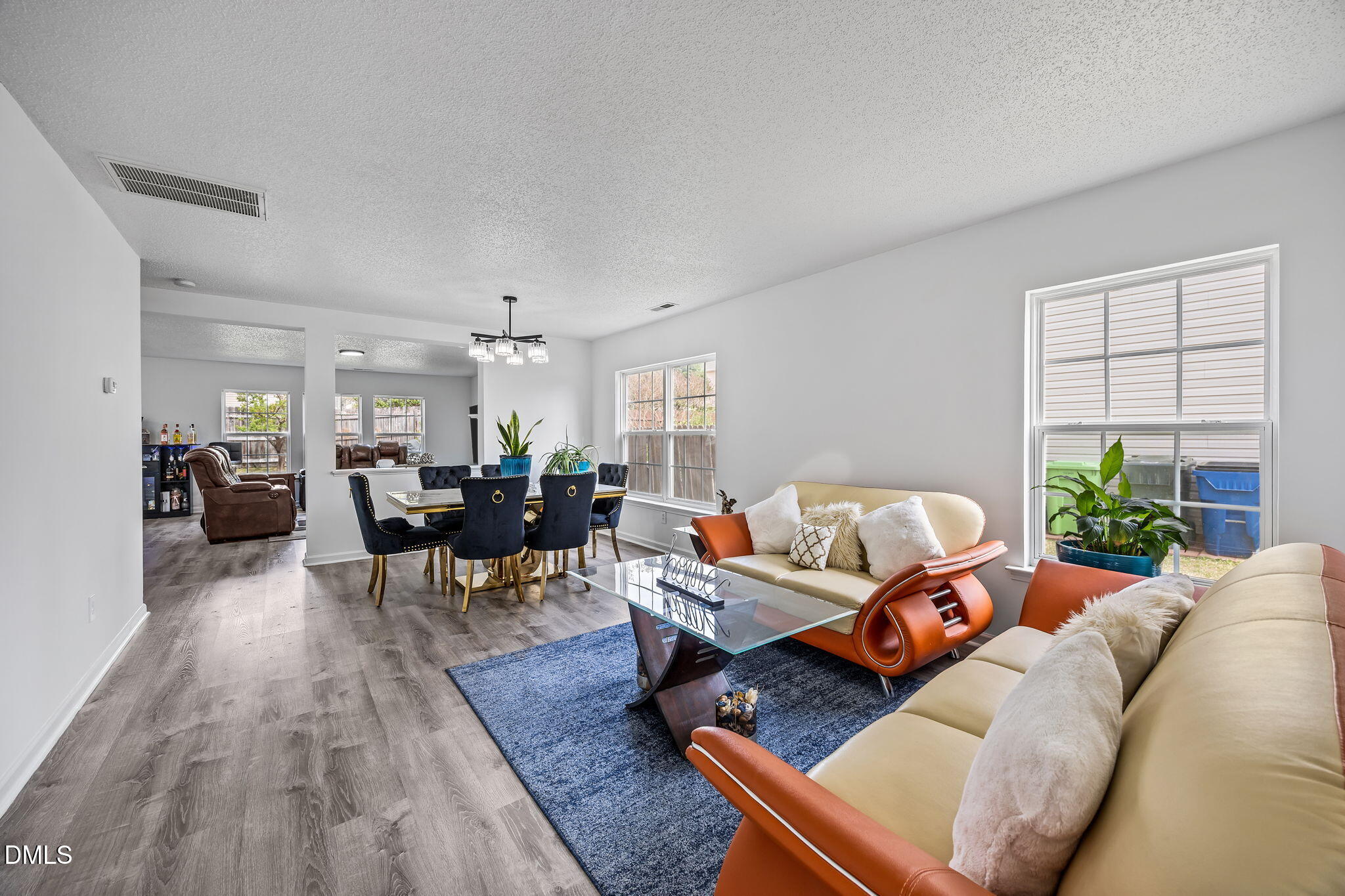 6307 Quitman Trail Raleigh, NC 27610 - Photo 9 of 35 a living room with furniture and wooden floor