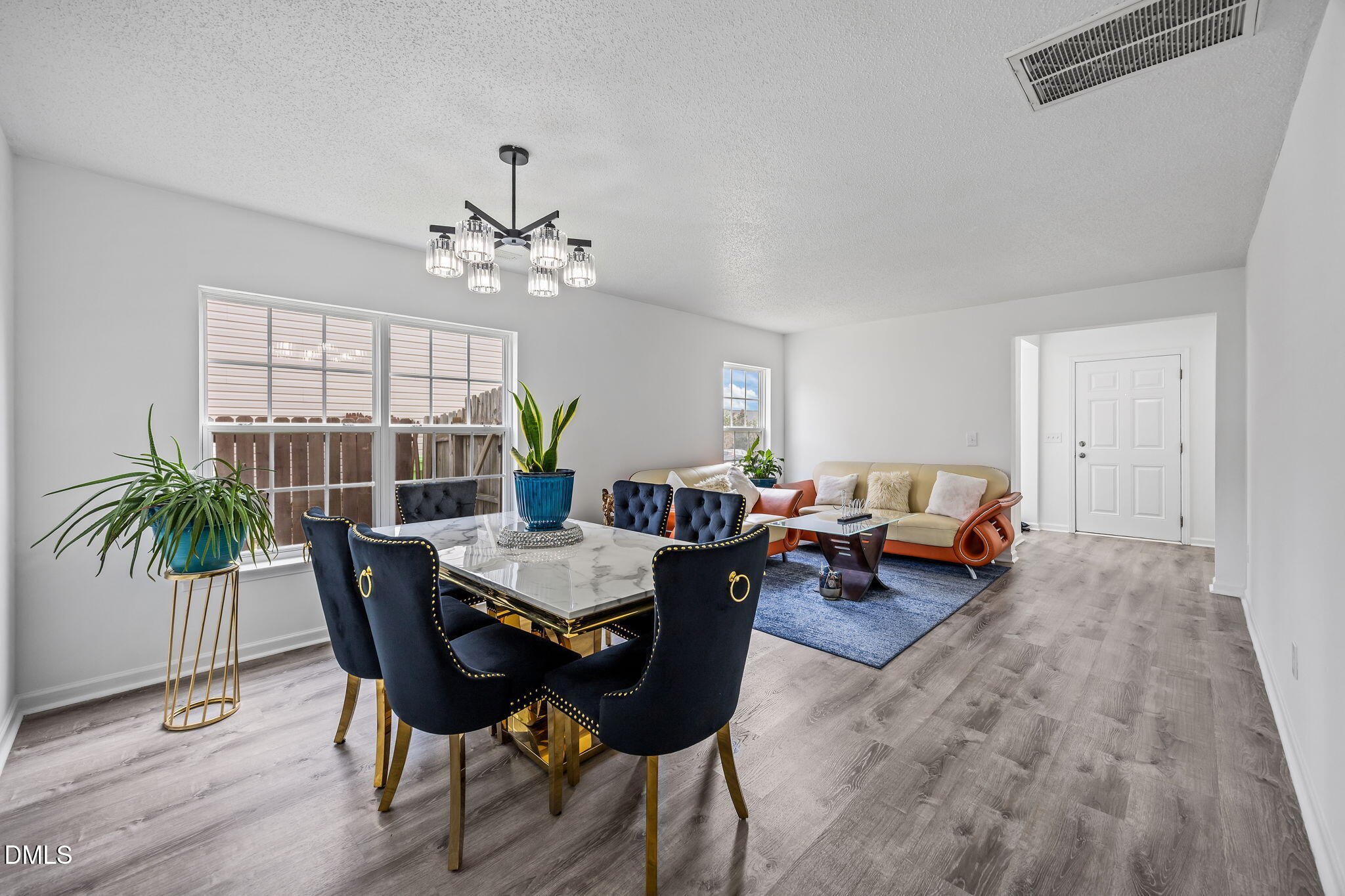 6307 Quitman Trail Raleigh, NC 27610 - Photo 10 of 35 a view of a livingroom with furniture and a table