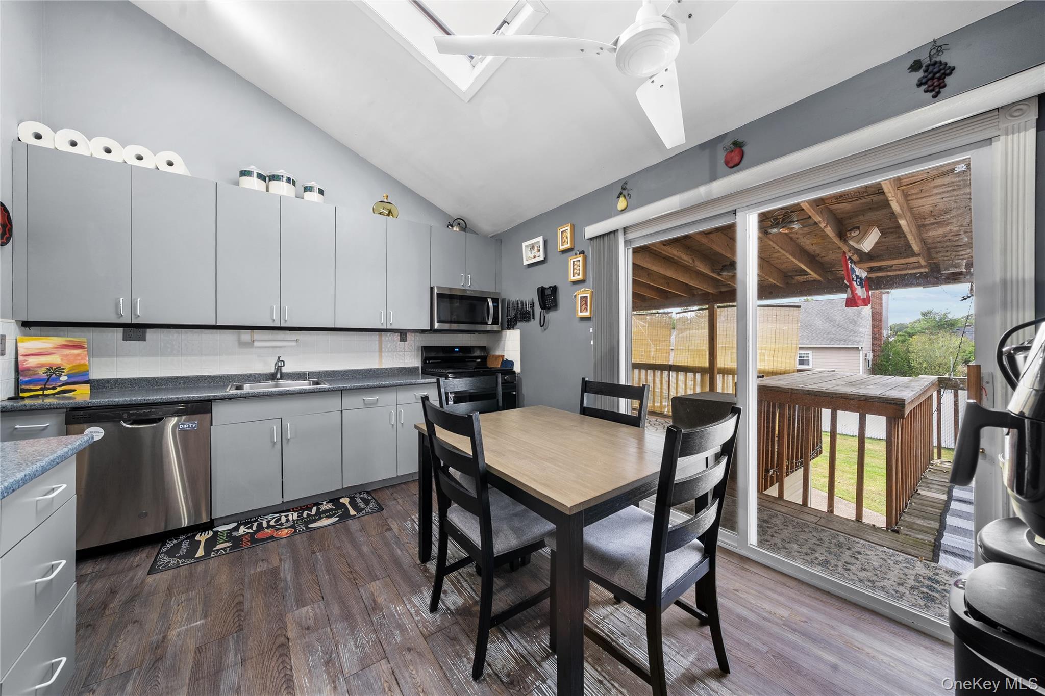 34 West 21st Street Deer Park, NY 11729 - Photo 12 of 33 a kitchen with a table chairs stove and cabinets