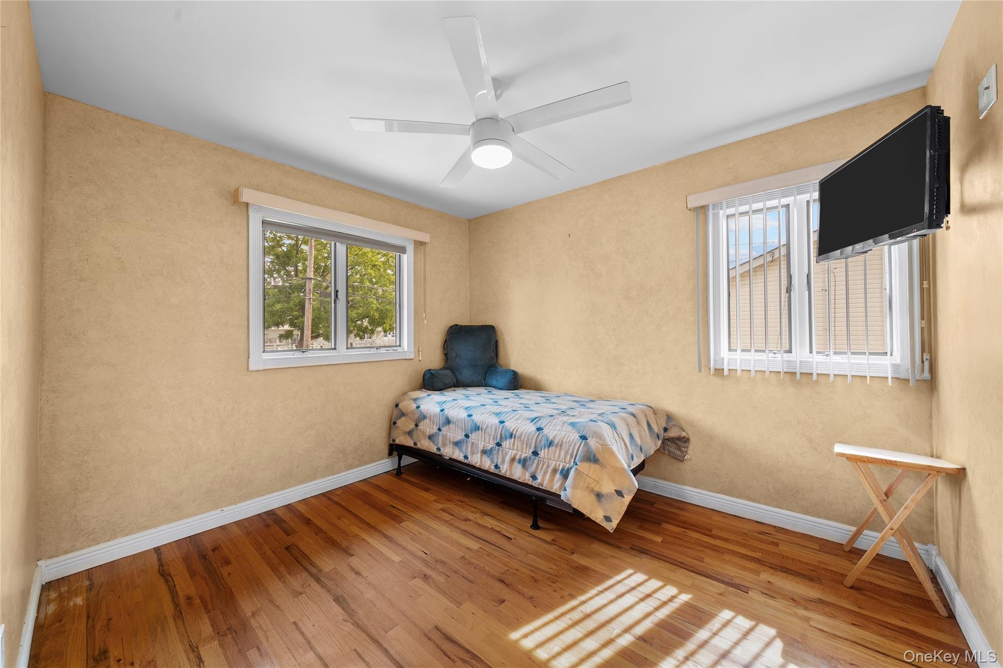 34 West 21st Street Deer Park, NY 11729 - Photo 16 of 33 a bedroom with bed and window