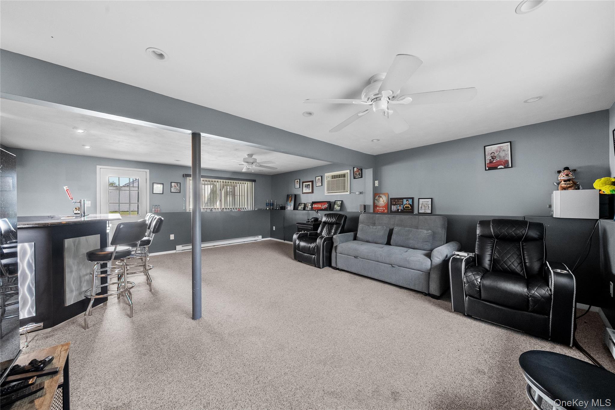 34 West 21st Street Deer Park, NY 11729 - Photo 18 of 33 a living room with furniture and a flat screen tv