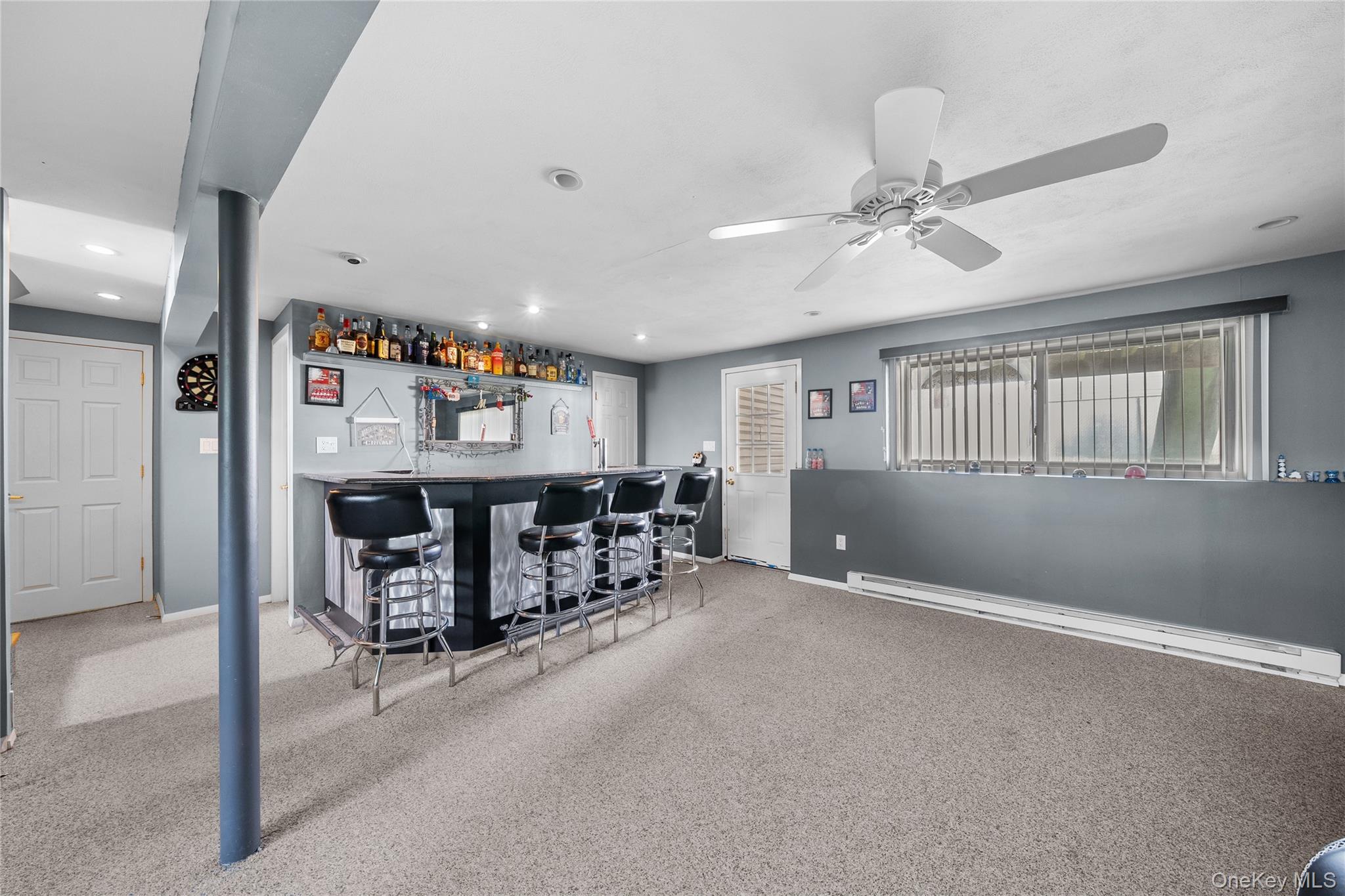 34 West 21st Street Deer Park, NY 11729 - Photo 19 of 33 a view of an empty room with furniture and a ceiling fan
