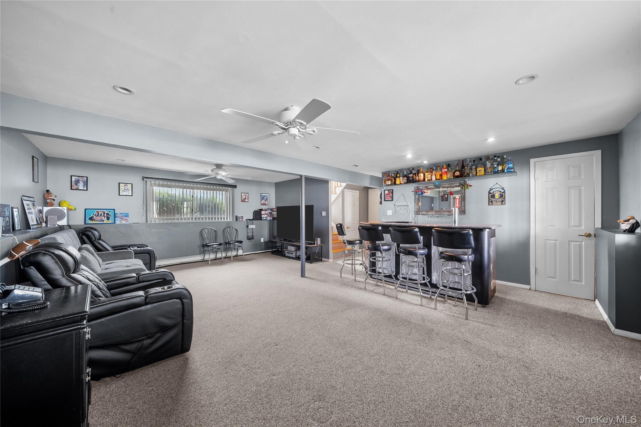 34 West 21st Street Deer Park, NY 11729 - Photo 20 of 33 a living room with furniture and a flat screen tv