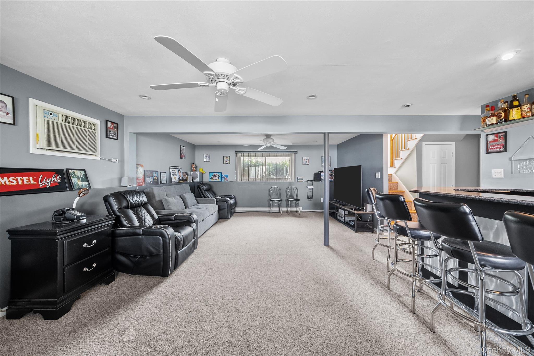 34 West 21st Street Deer Park, NY 11729 - Photo 21 of 33 a living room with furniture and a flat screen tv