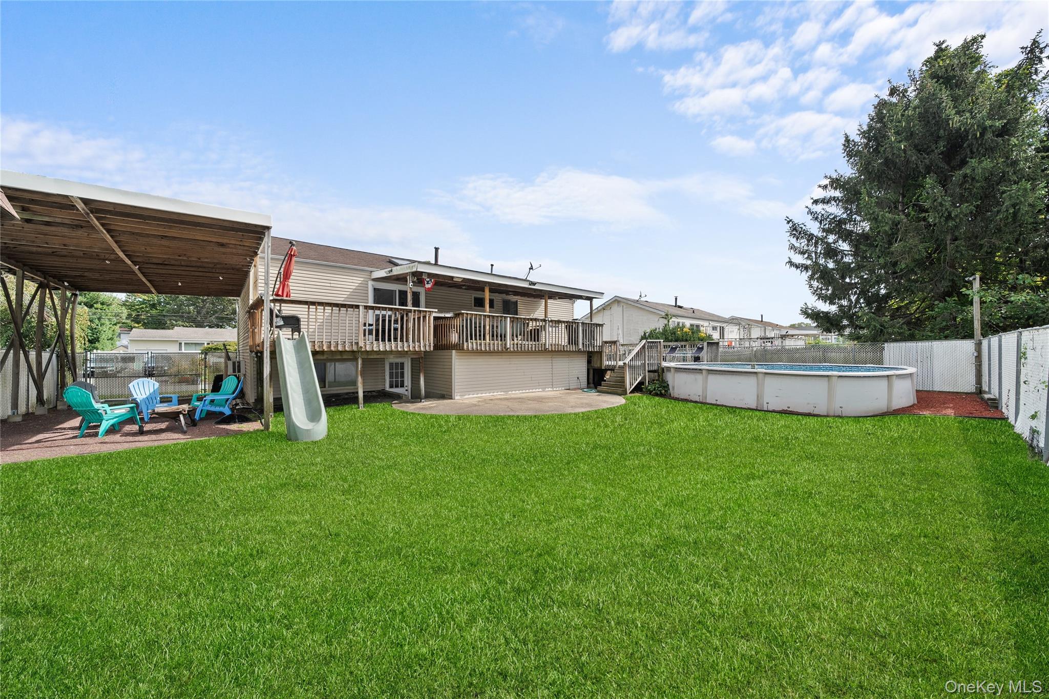 34 West 21st Street Deer Park, NY 11729 - Photo 28 of 33 a view of a porch with a yard