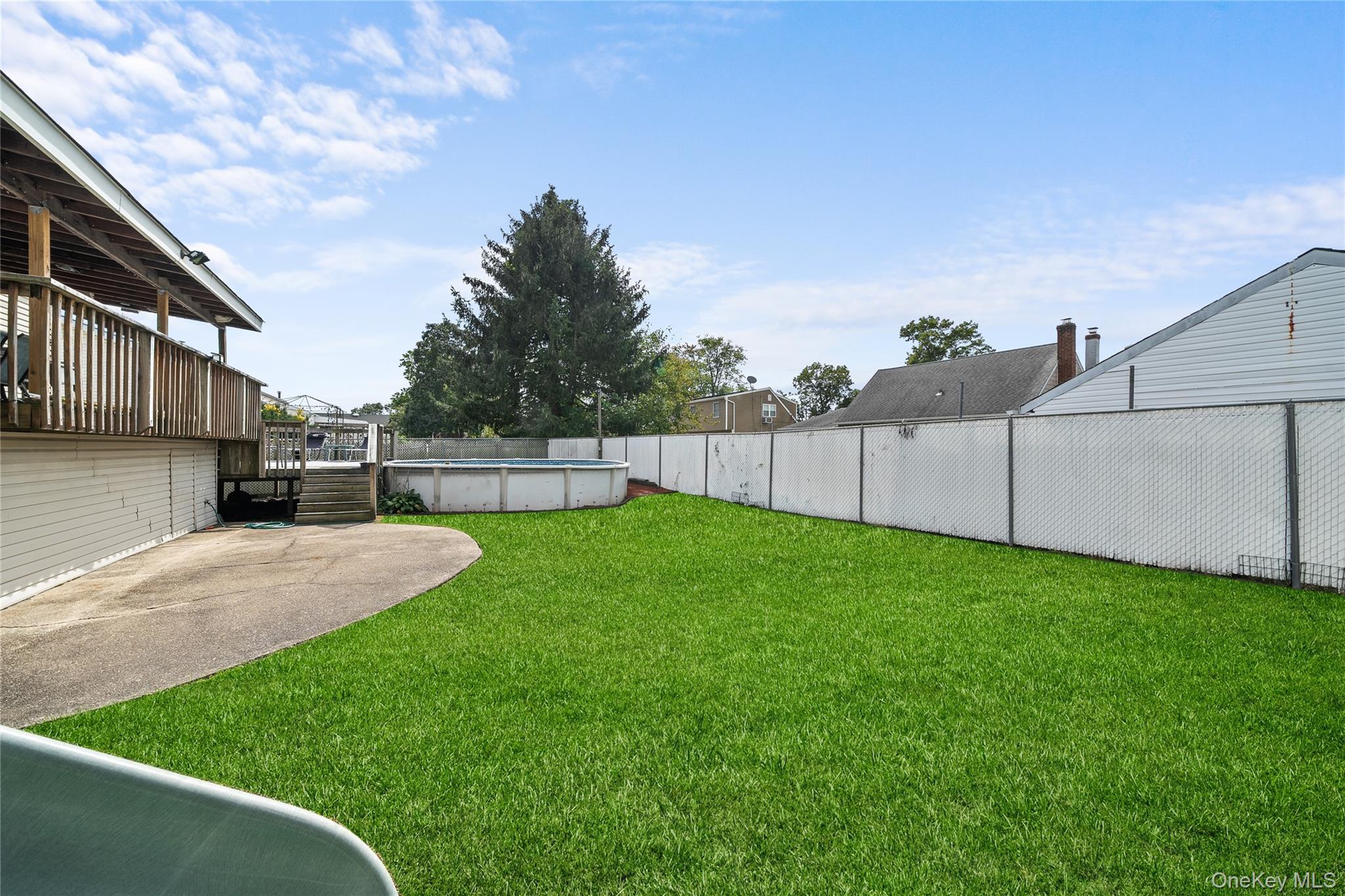34 West 21st Street Deer Park, NY 11729 - Photo 29 of 33 a view of backyard with green space