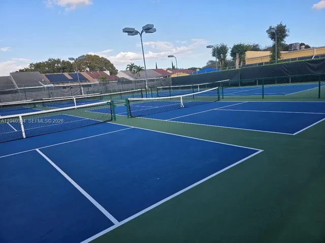 a wooden bench sitting in front of a door